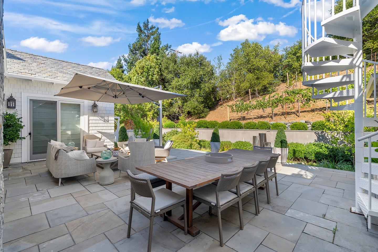 14966 Sobey Road Saratoga, CA 95070 - Photo 51 of 70 a view of a patio with table and chairs and potted plants