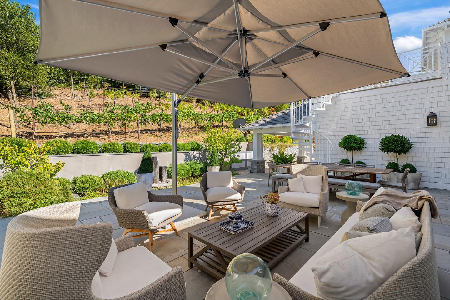 14966 Sobey Road Saratoga, CA 95070 - Photo 52 of 70 a view of a patio with couches and chairs under an umbrella