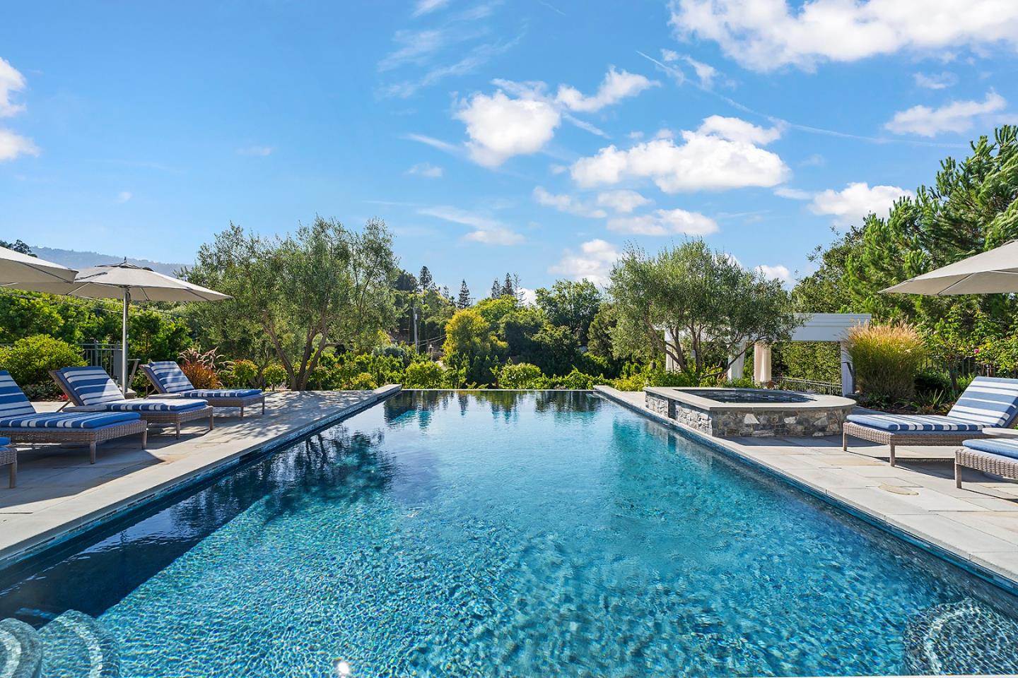 14966 Sobey Road Saratoga, CA 95070 - Photo 57 of 70 a swimming pool with outdoor seating and barbeque oven