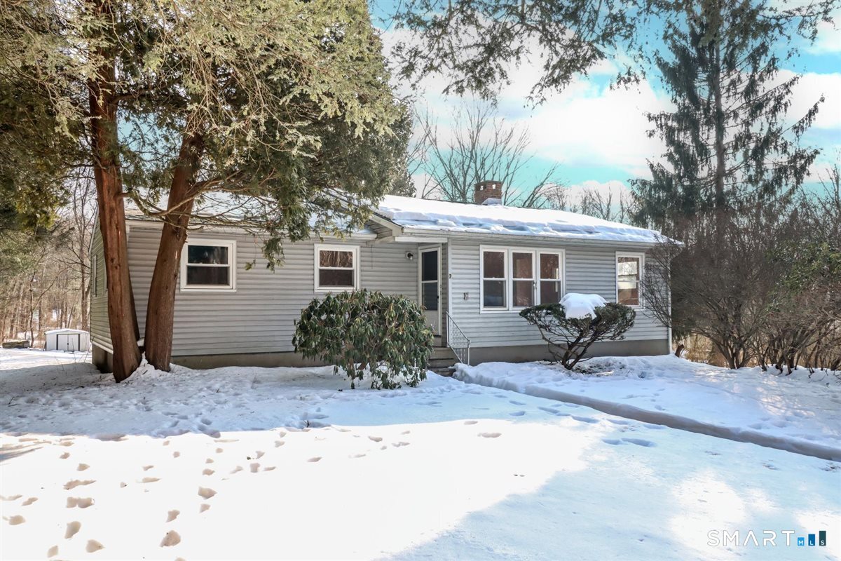 7 Longview Road Newtown, CT 06482 - Photo 1 of 1 a front view of a house with a yard