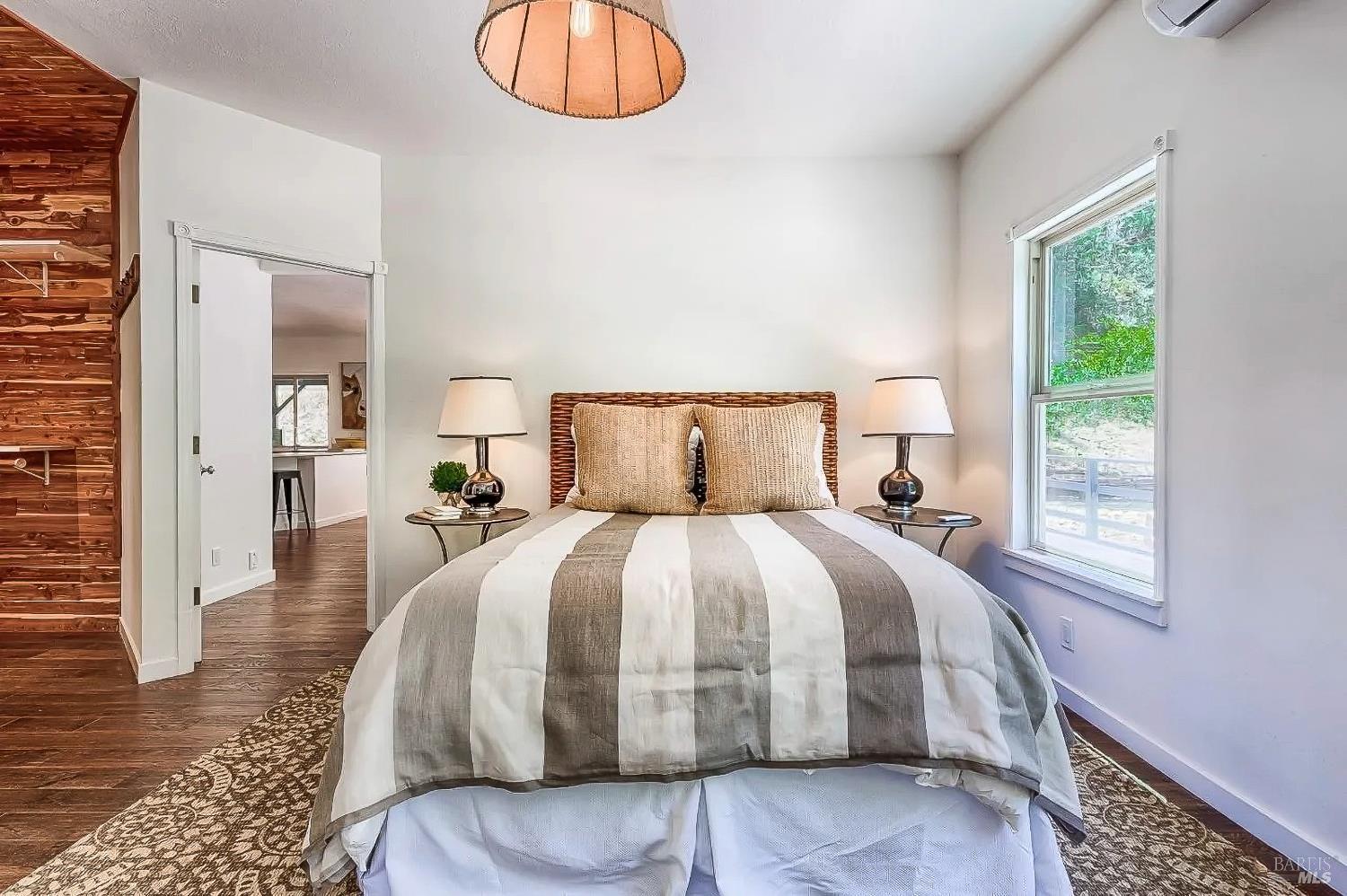 19500 Mountain View Road Boonville, CA 95415 - Photo 19 of 67 a bed sitting in a bedroom next to a window