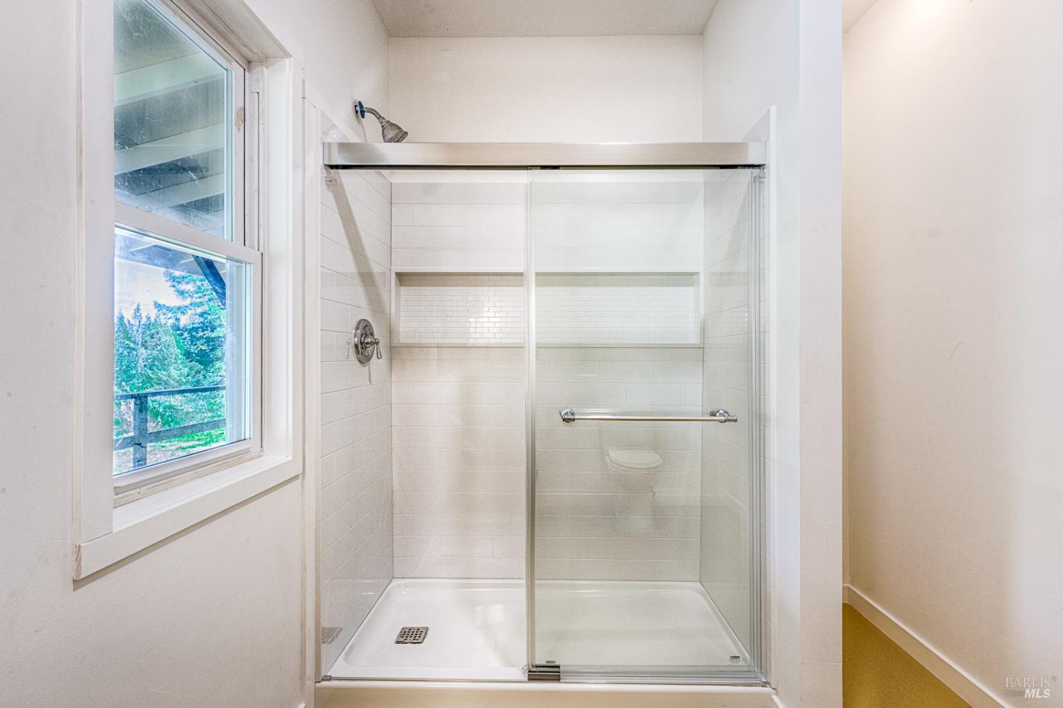 19500 Mountain View Road Boonville, CA 95415 - Photo 21 of 67 a bathroom with a glass shower door