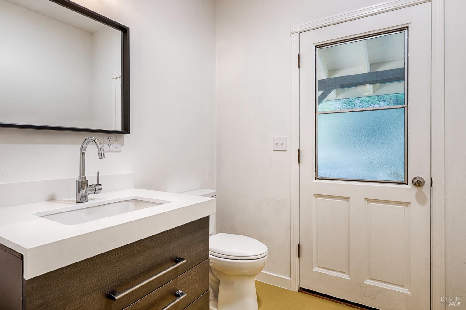 19500 Mountain View Road Boonville, CA 95415 - Photo 23 of 67 a bathroom with a sink a toilet and mirror