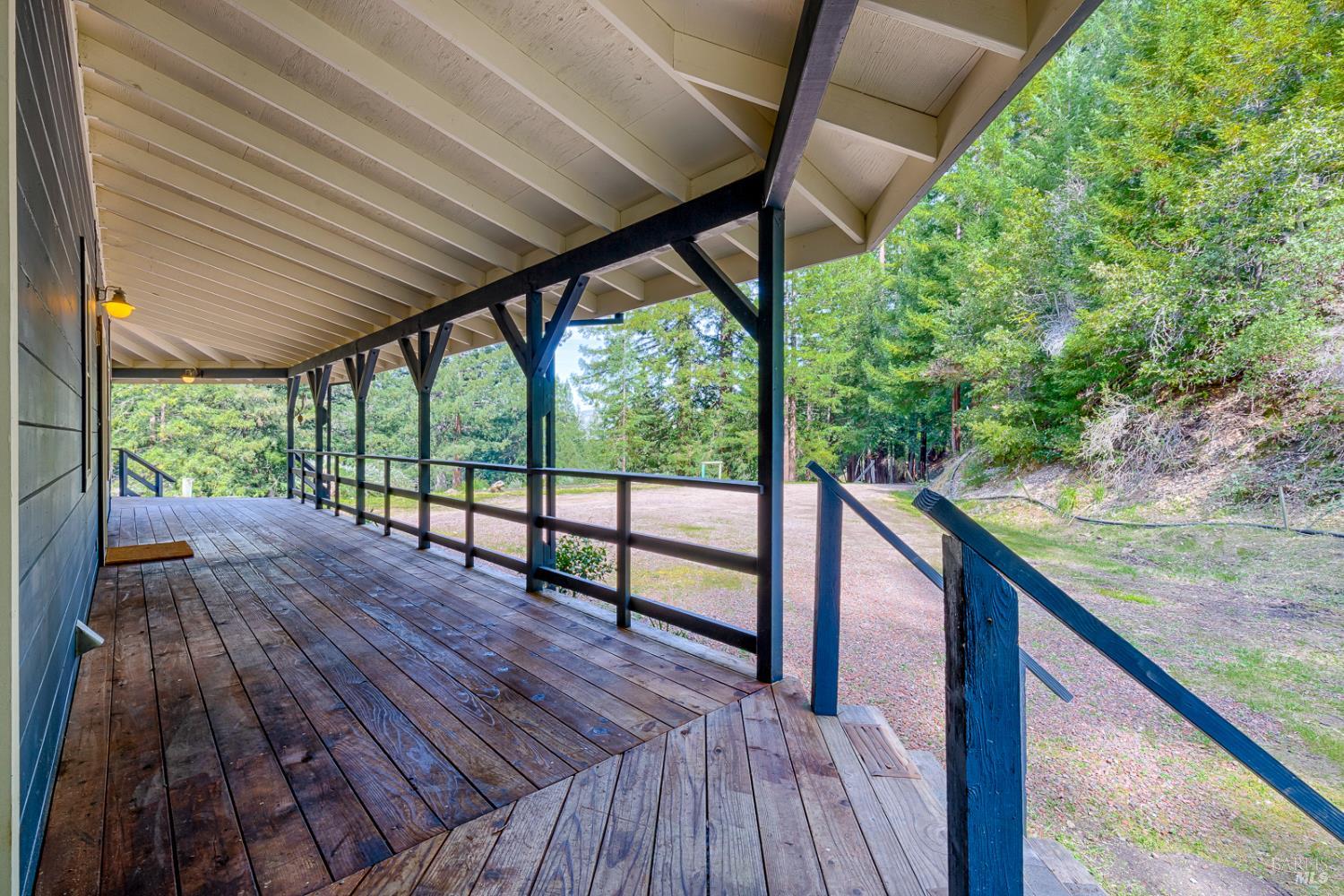 19500 Mountain View Road Boonville, CA 95415 - Photo 39 of 67 a balcony with wooden floor and outdoor seating