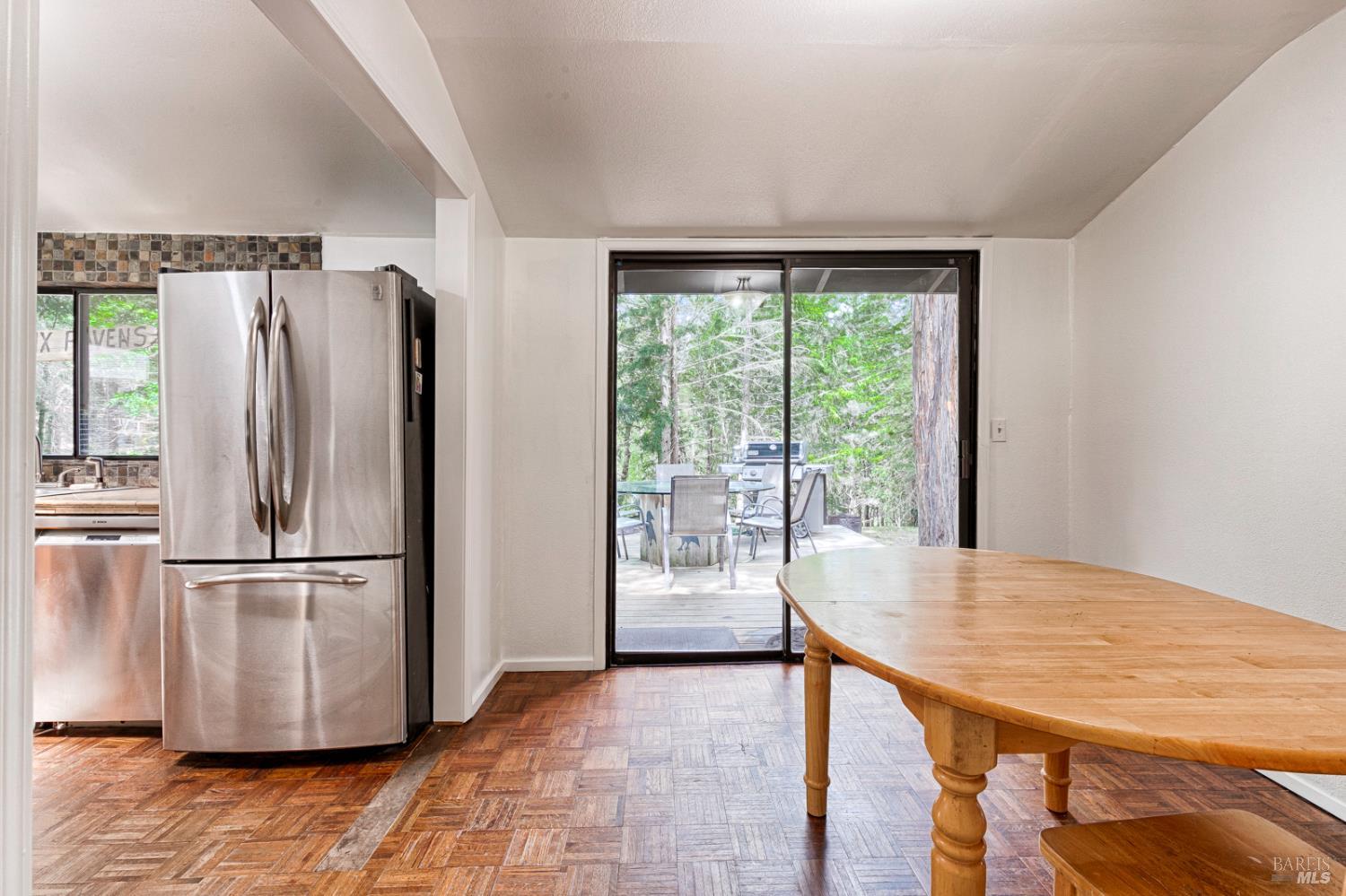 19500 Mountain View Road Boonville, CA 95415 - Photo 50 of 67 a kitchen with stainless steel appliances granite countertop a refrigerator a stove and a wooden floors