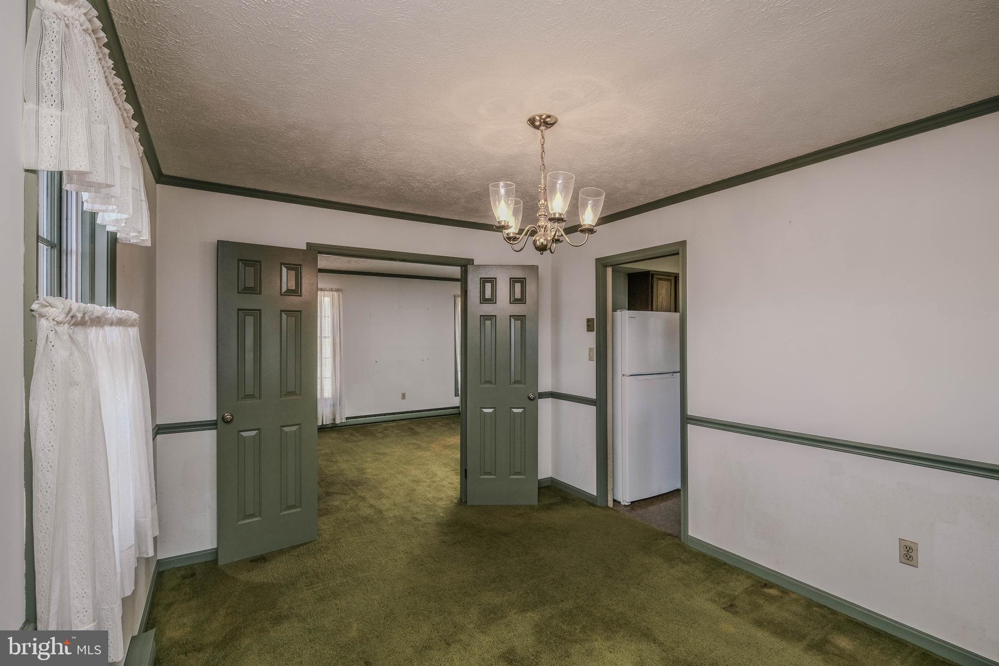107 Richmond Road Front Royal, VA 22630 - Photo 13 of 75 Formal dining room w/ double doors to living room