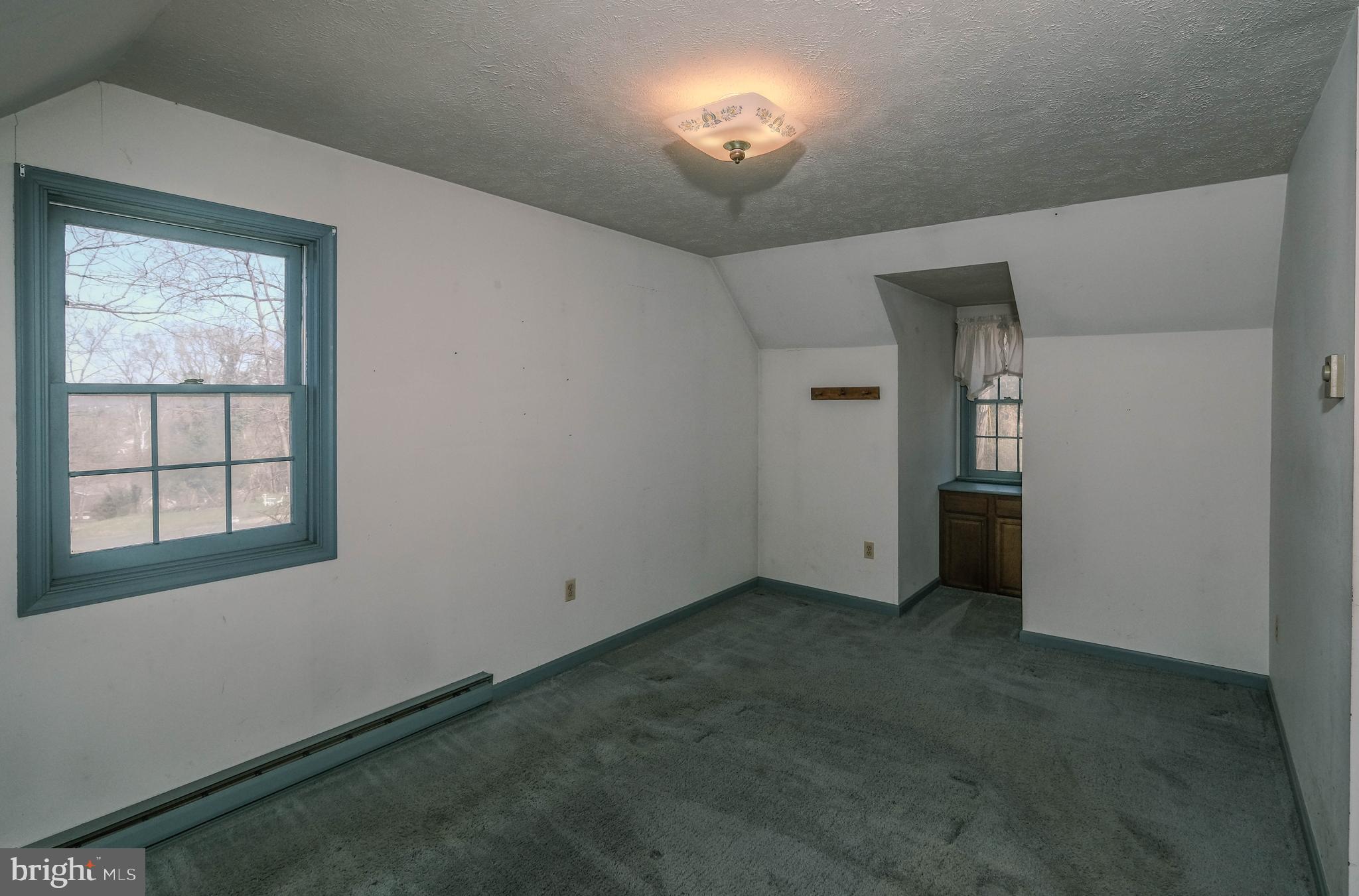 107 Richmond Road Front Royal, VA 22630 - Photo 35 of 75 Primary suite w/ built in storage in dormer area