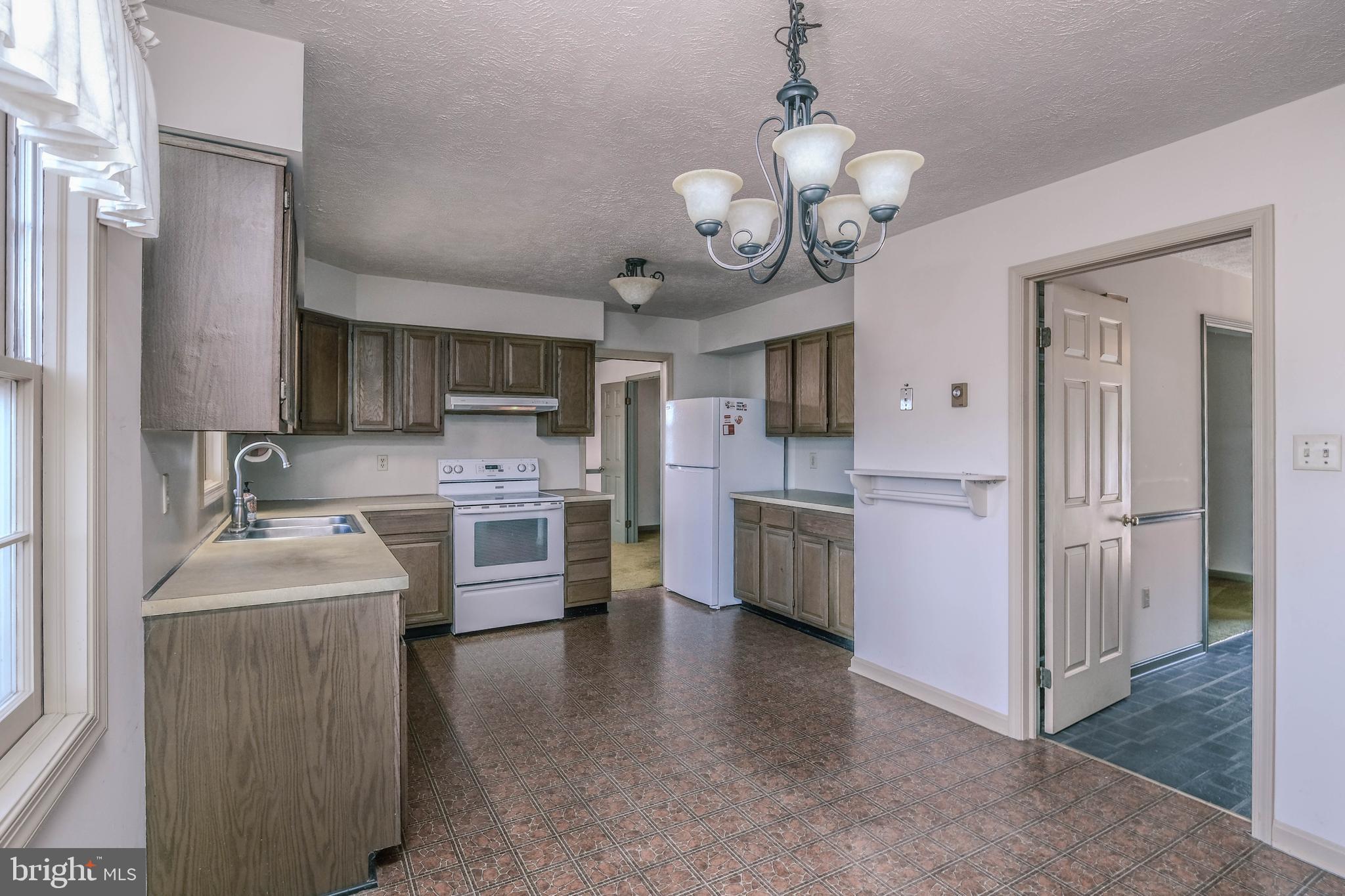 107 Richmond Road Front Royal, VA 22630 - Photo 6 of 72 Formal dining room and family room are off kitchen