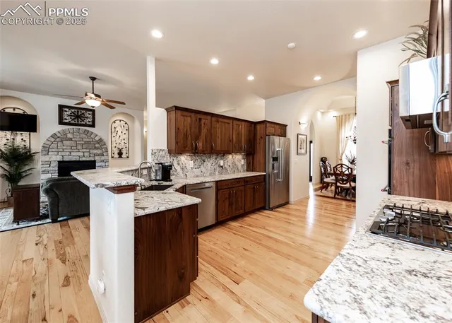 a kitchen with lots of counter top space and appliances