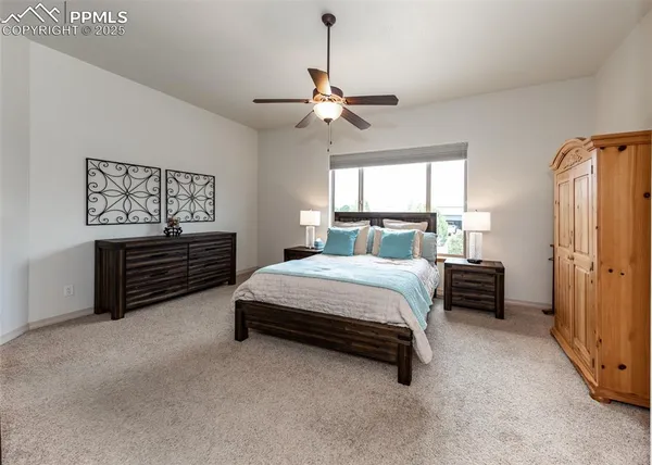 a bedroom with a bed dresser and a window