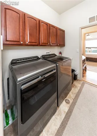 a kitchen with stainless steel appliances granite countertop a stove a microwave and a sink