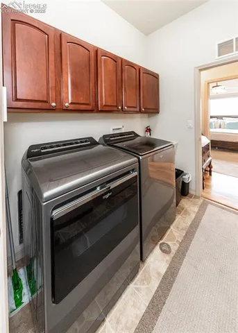 a kitchen with stainless steel appliances granite countertop a stove a microwave and a sink