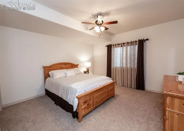 a bedroom with a bed and window