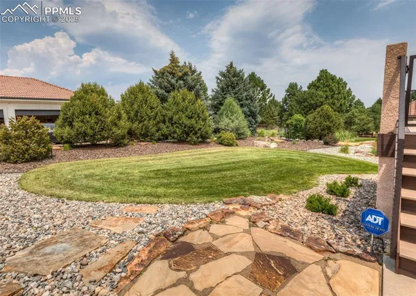 a view of a golf course with a yard