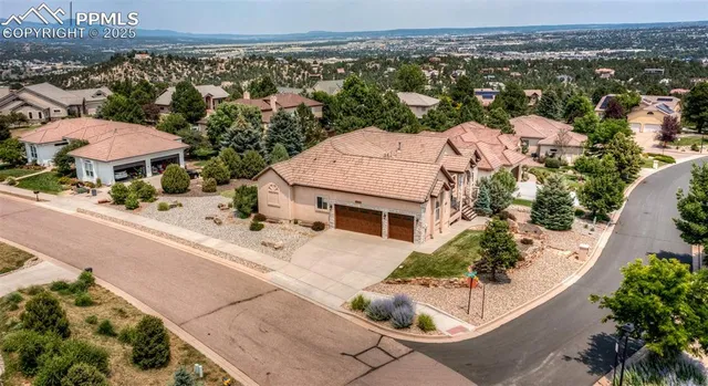 an aerial view of house with yard