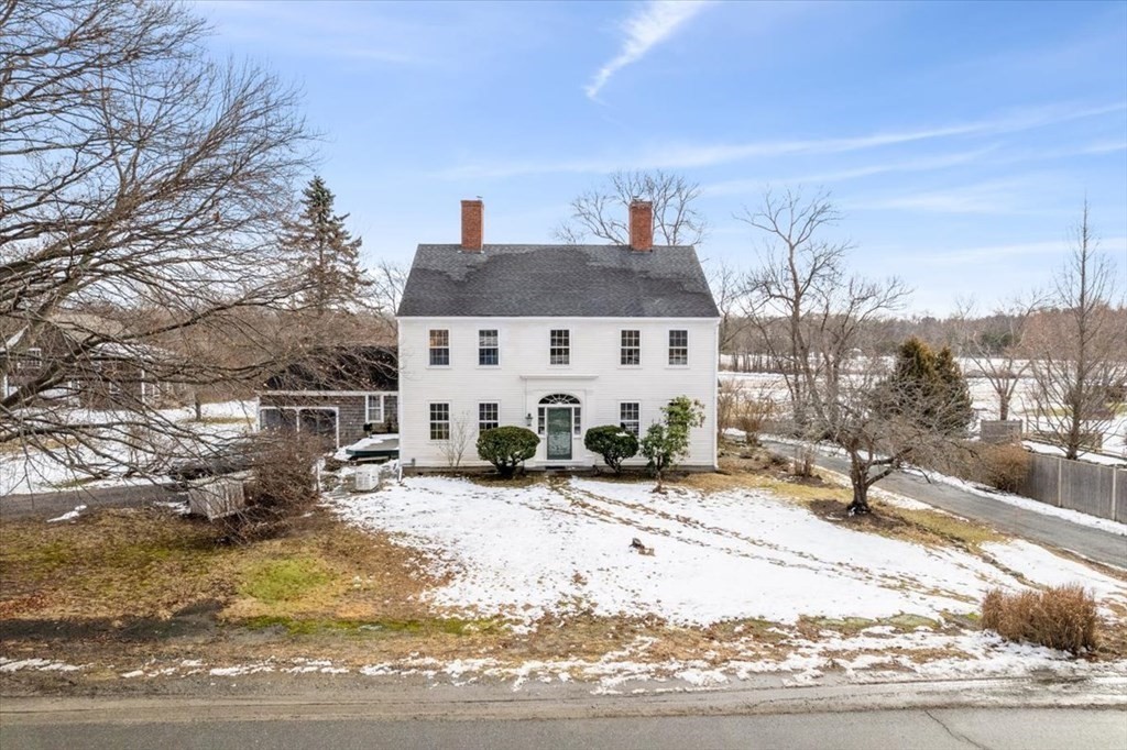 a view of house with outdoor seating