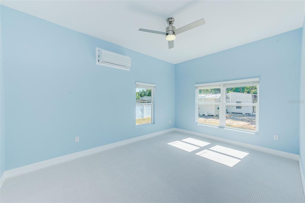 11111 Hackney Drive Riverview, FL 33578 - Photo 15 of 40 an empty room with windows and fan