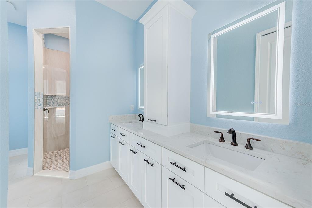 11111 Hackney Drive Riverview, FL 33578 - Photo 18 of 40 a bathroom with double sink and a mirror