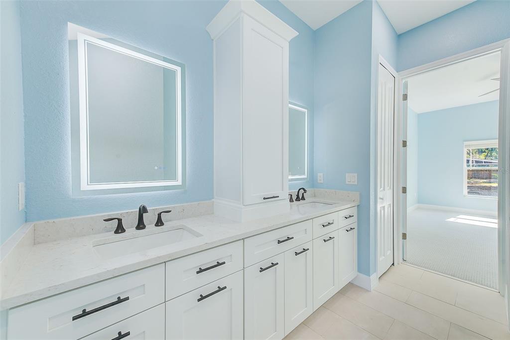 11111 Hackney Drive Riverview, FL 33578 - Photo 19 of 40 a bathroom with double sink and a mirror
