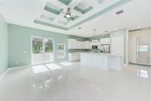 a view of a kitchen with a sink and a window