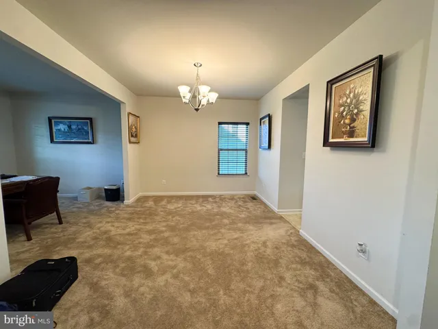 a view of a livingroom with a workspace
