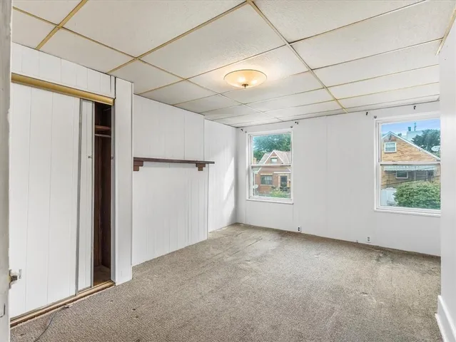 an empty room with a empty space and a window