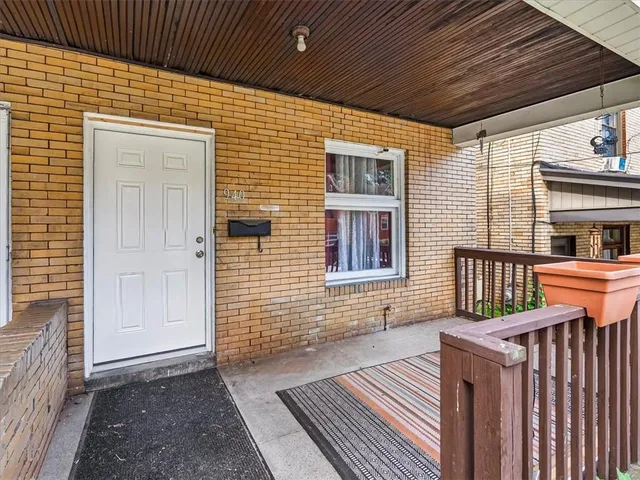 wooden floor in an empty room with a fireplace