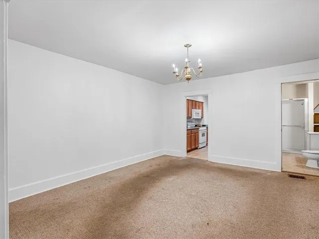 a kitchen with stainless steel appliances granite countertop a stove top oven a sink a counter space and cabinets