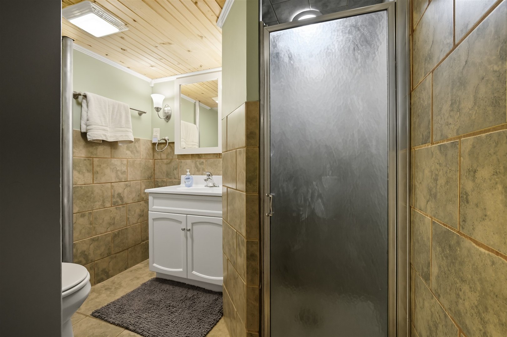 1103 Morgan Street Normal, IL 61761 - Photo 24 of 35 a bathroom with a sink a mirror and a shower