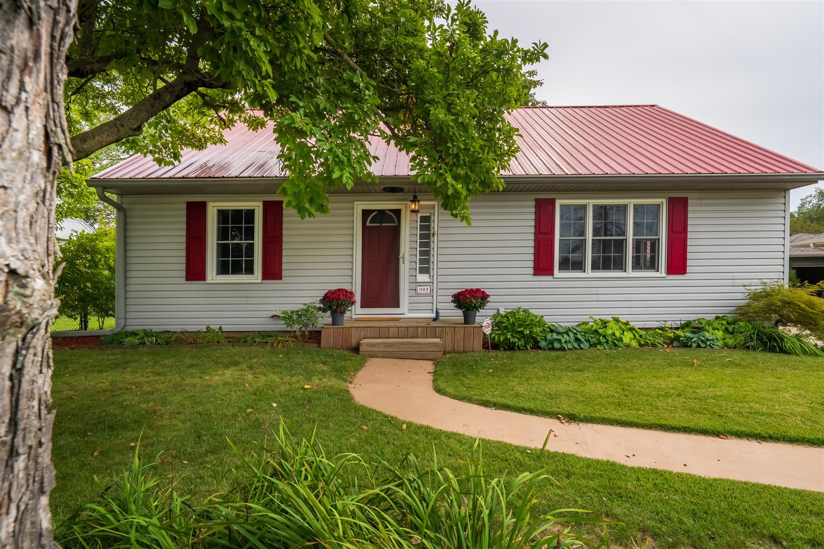 1103 Morgan Street Normal, IL 61761 - Photo 35 of 35 a front view of a house with a yard and garage