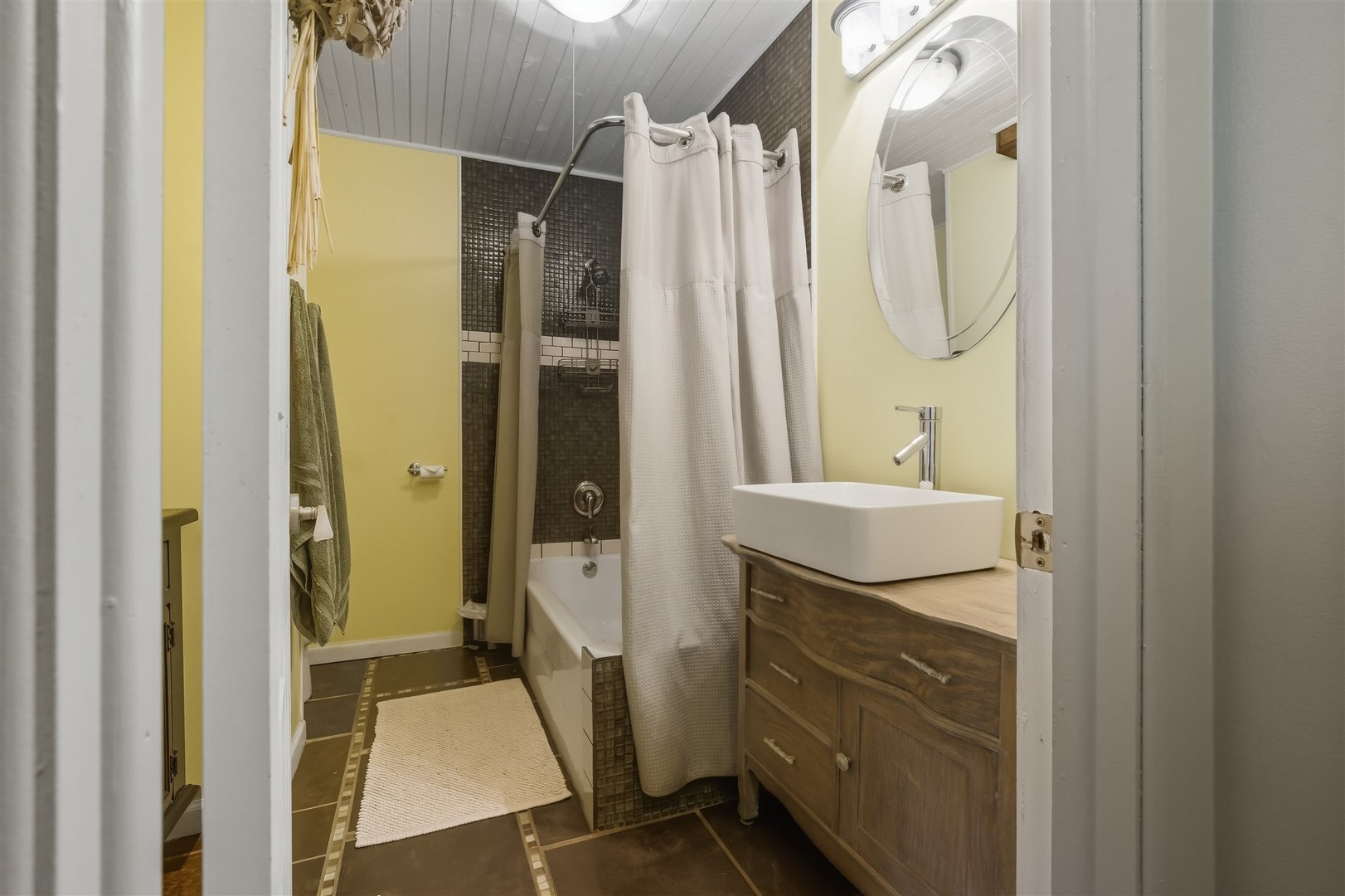 1103 Morgan Street Normal, IL 61761 - Photo 5 of 35 a bathroom with a double vanity sink mirror and shower