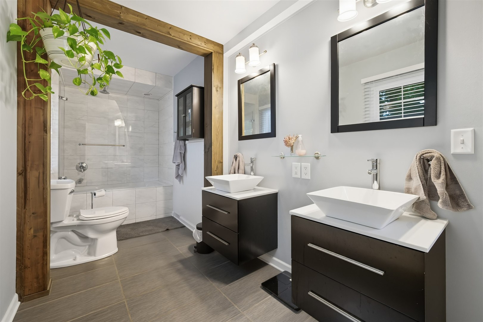 1103 Morgan Street Normal, IL 61761 - Photo 8 of 35 a bathroom with a sink toilet and shower