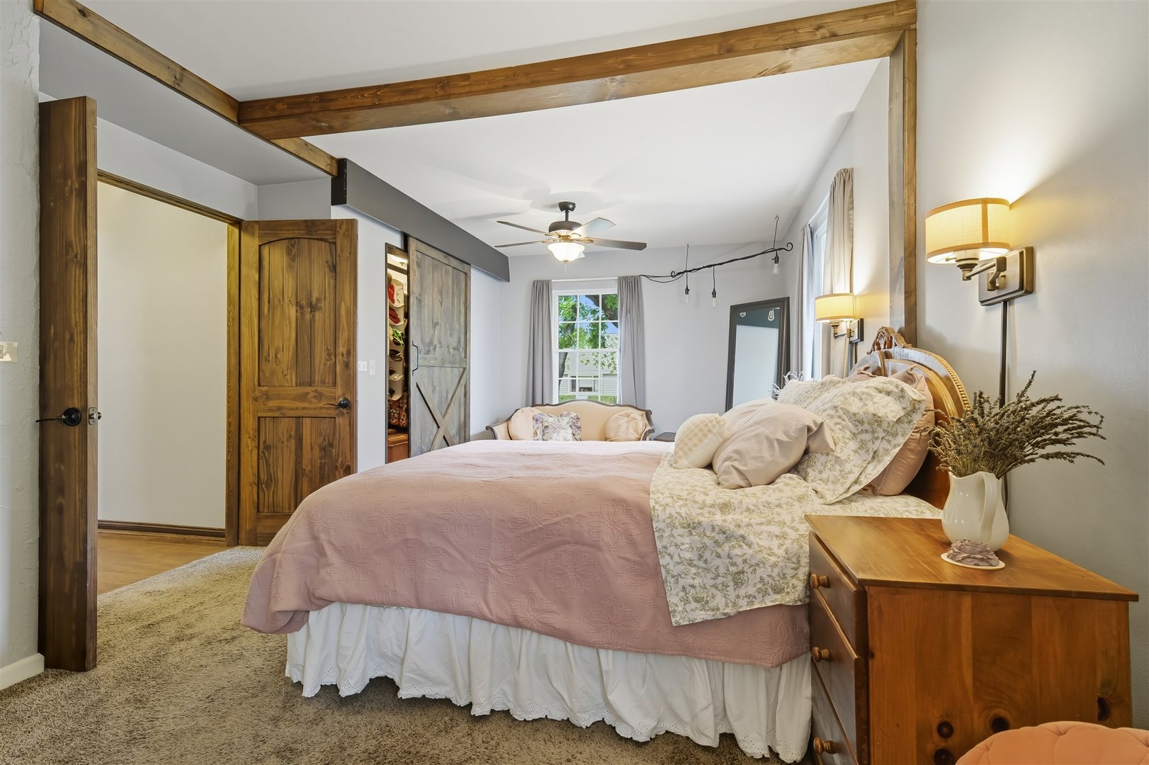 1103 Morgan Street Normal, IL 61761 - Photo 9 of 35 a bedroom with a large bed and a chandelier