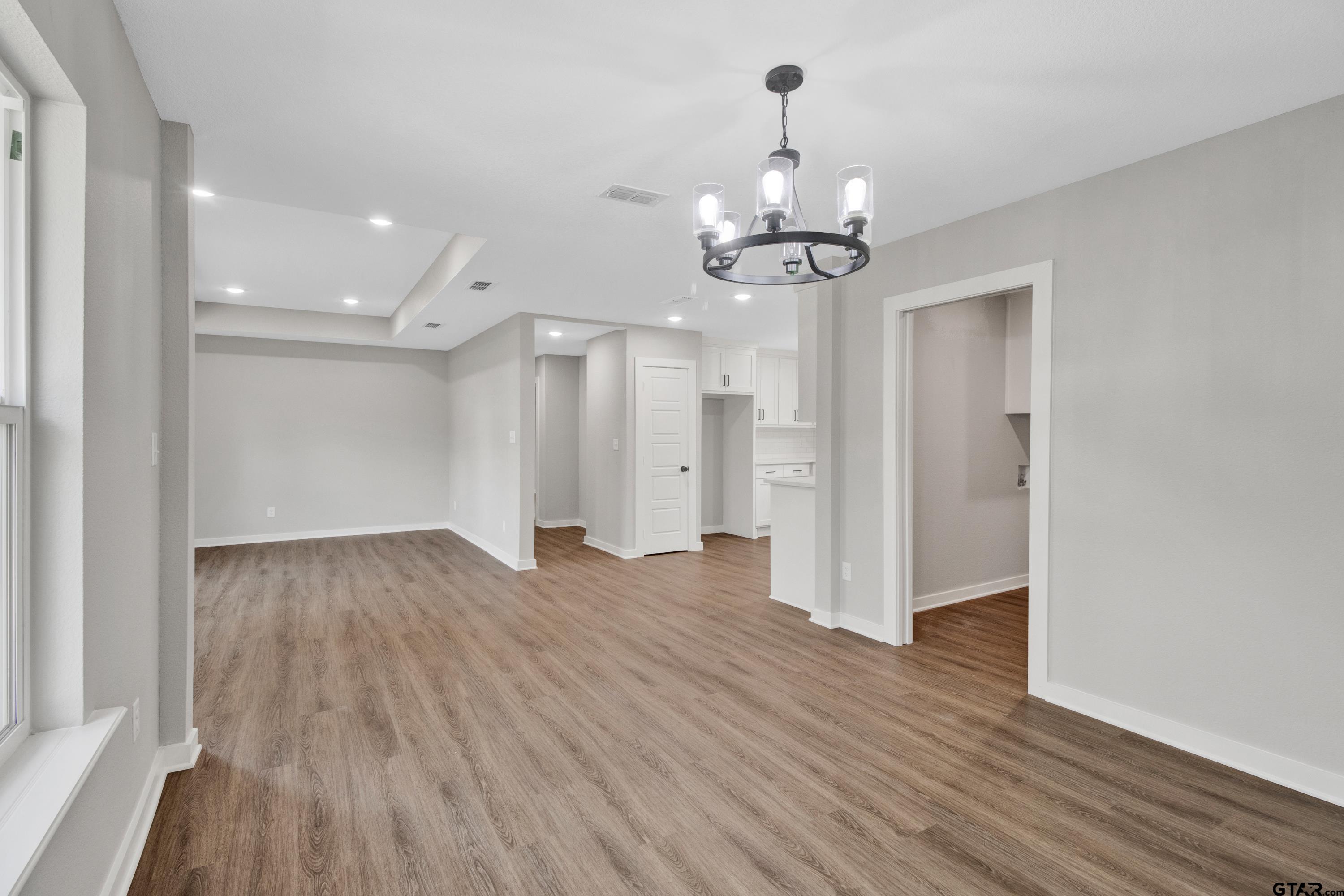 1448 Crescent Drive Tyler, TX 75702 - Photo 12 of 32 a view of a livingroom with wooden floor