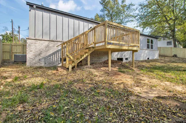 a backyard of a house with outdoor seating