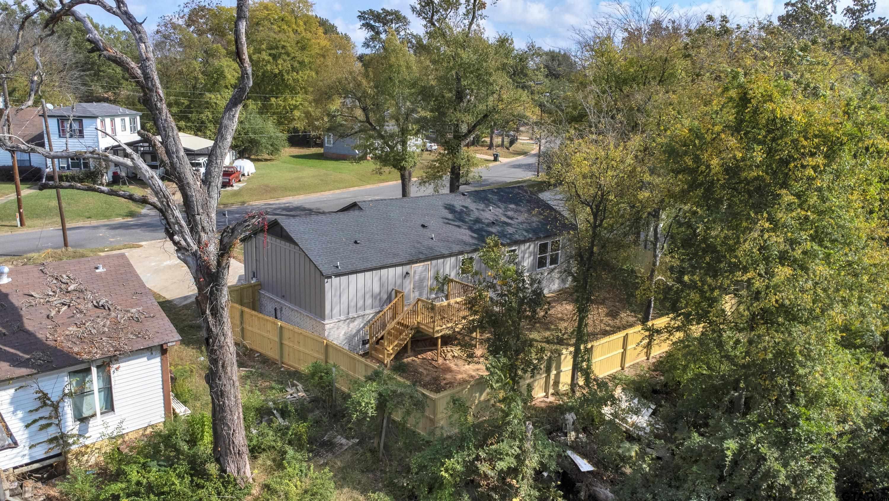1448 Crescent Drive Tyler, TX 75702 - Photo 28 of 32 a view of a tree in front of a house