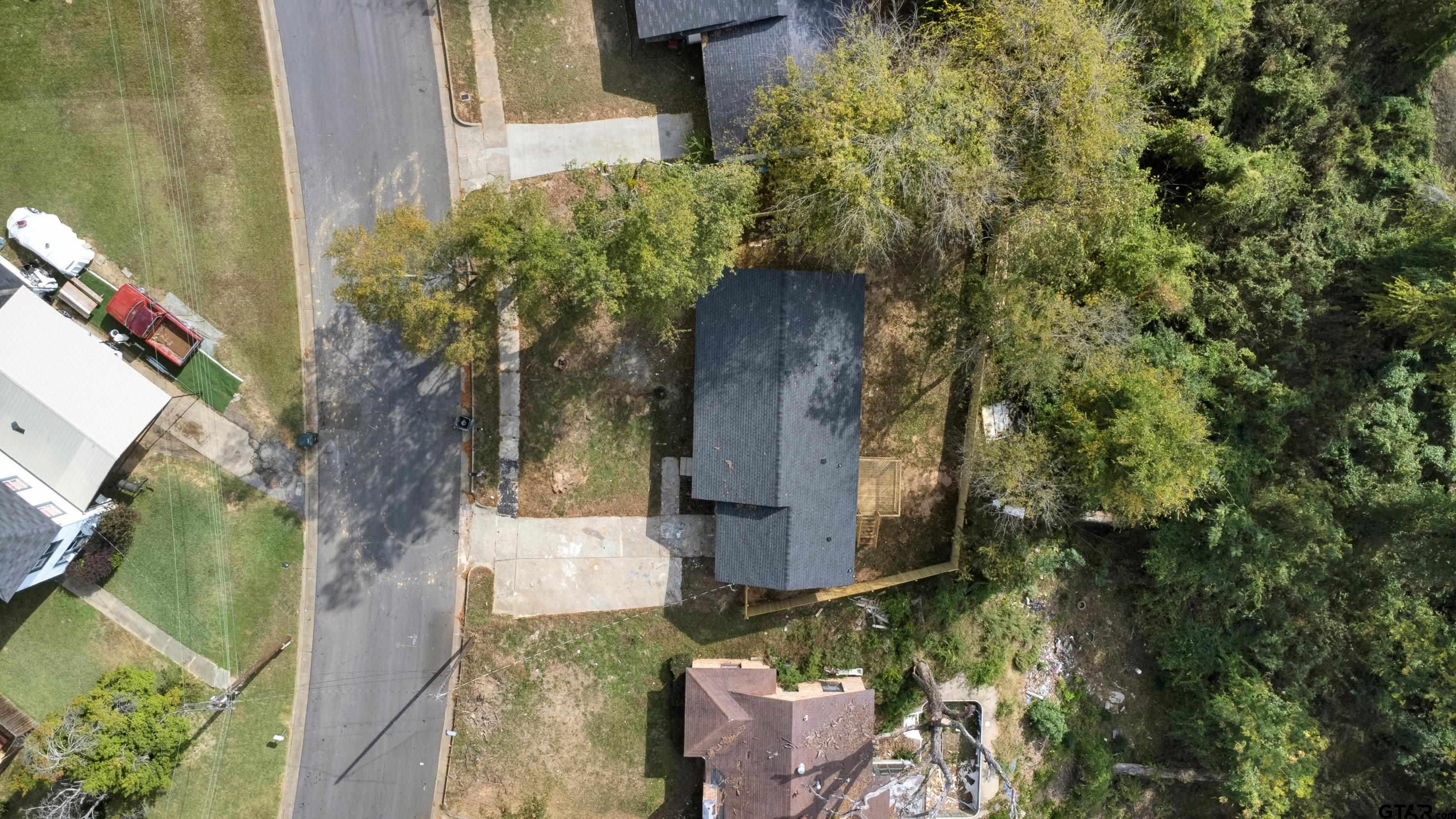 1448 Crescent Drive Tyler, TX 75702 - Photo 29 of 32 a backyard of a house with outdoor seating