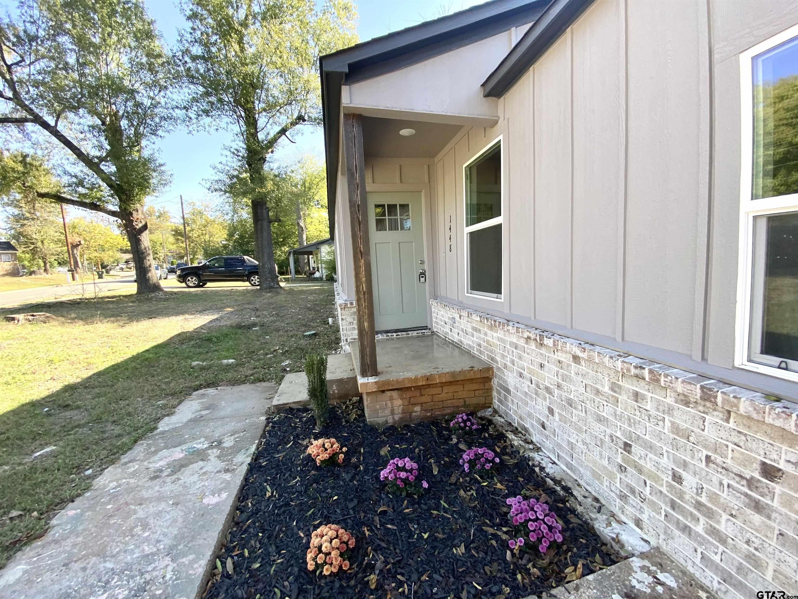 1448 Crescent Drive Tyler, TX 75702 - Photo 3 of 32 front view of a house with a yard