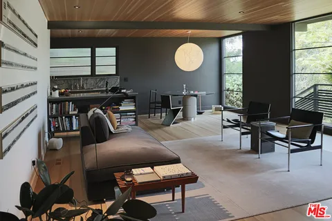 a bedroom with two beds and a window