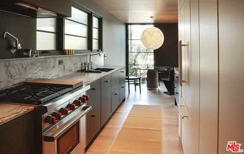 a en suite bathroom with a sink and a mirror