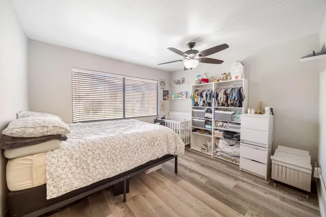 a bedroom with furniture and a chandelier