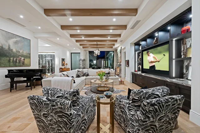 a view of a a dining room with furniture window and wooden floor