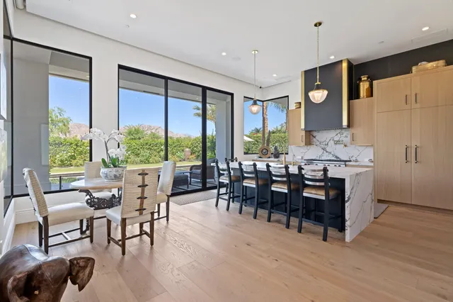 a kitchen with stainless steel appliances granite countertop a stove and a refrigerator