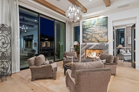 a view of a dining room with furniture and a large window