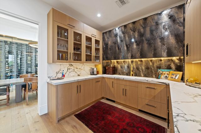 a utility room with sink dryer and washer