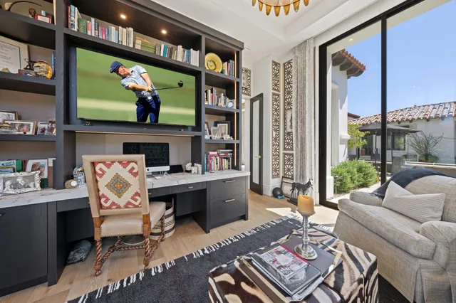 a kitchen with a sink cabinets and wooden floor