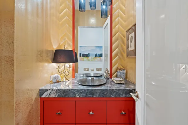 a bedroom with a bed a couch and a window