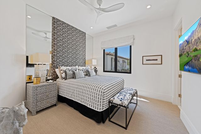 a bathroom with a double vanity sink mirror and shower