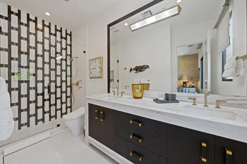 an aerial view of a house with swimming pool garden view and a lake view