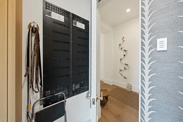 a patio with a table and chairs under an umbrella